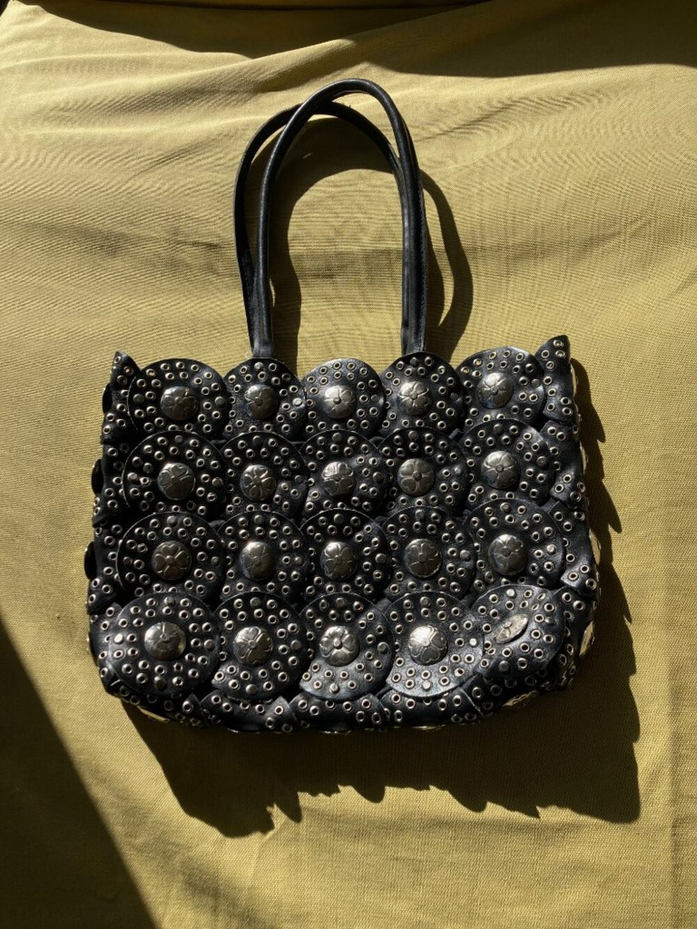 Black leather bag with rivots and metal buttons 15"X12"